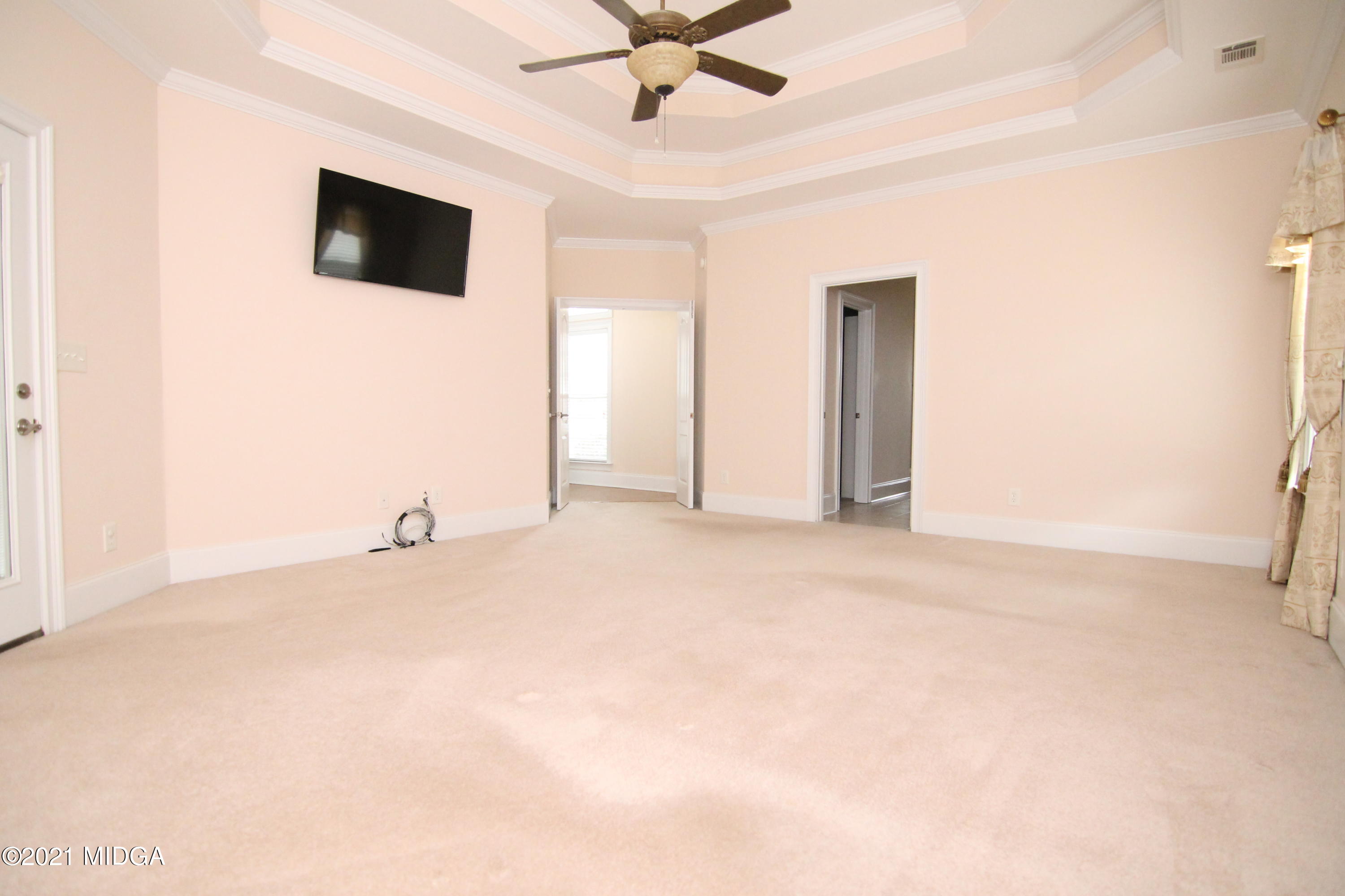 629 Toomer Road Perry, GA 31069 - Photo 21 of 59 an empty room with fan and windows