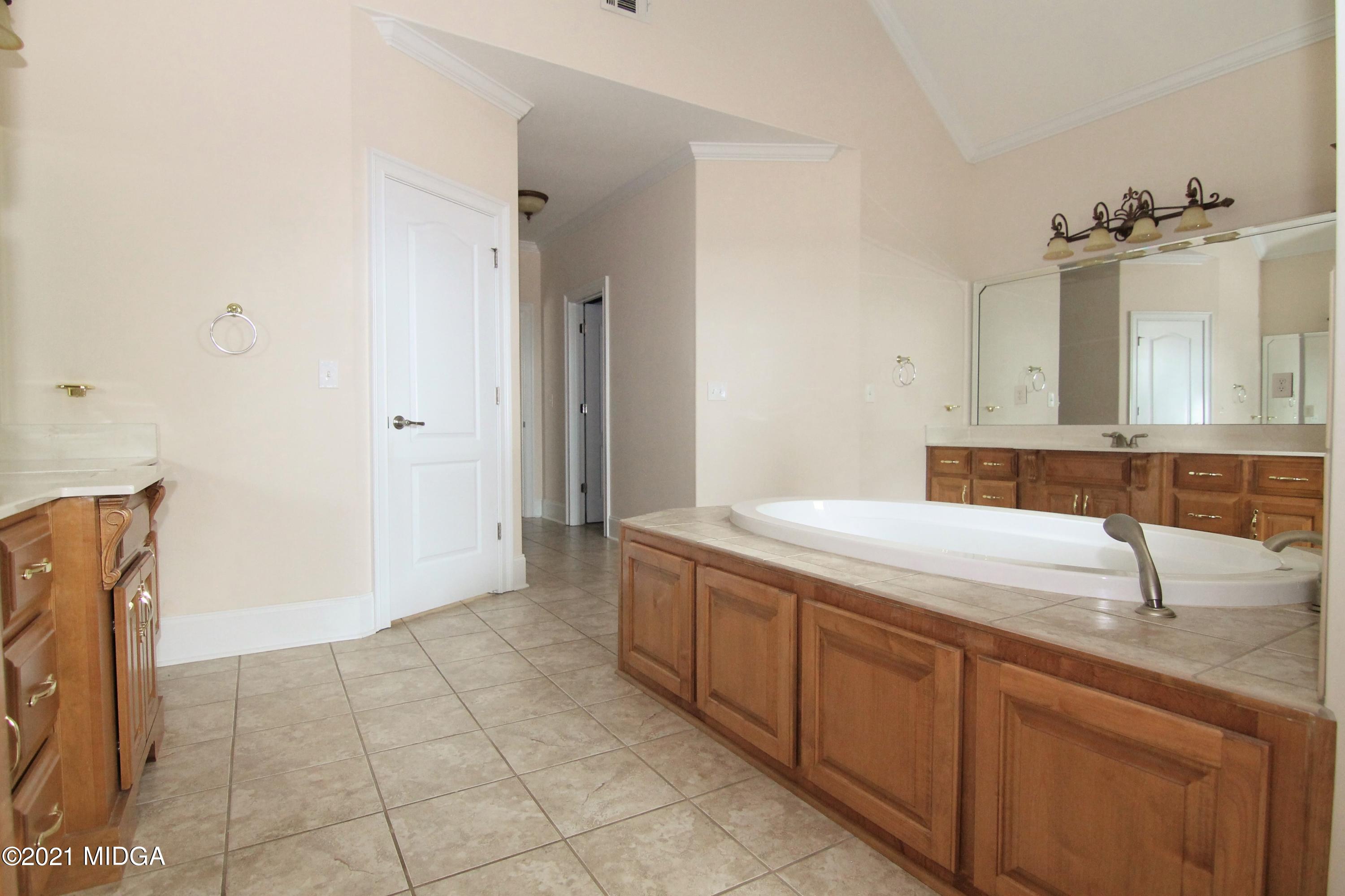 629 Toomer Road Perry, GA 31069 - Photo 25 of 59 a bathroom with a sink and a mirror
