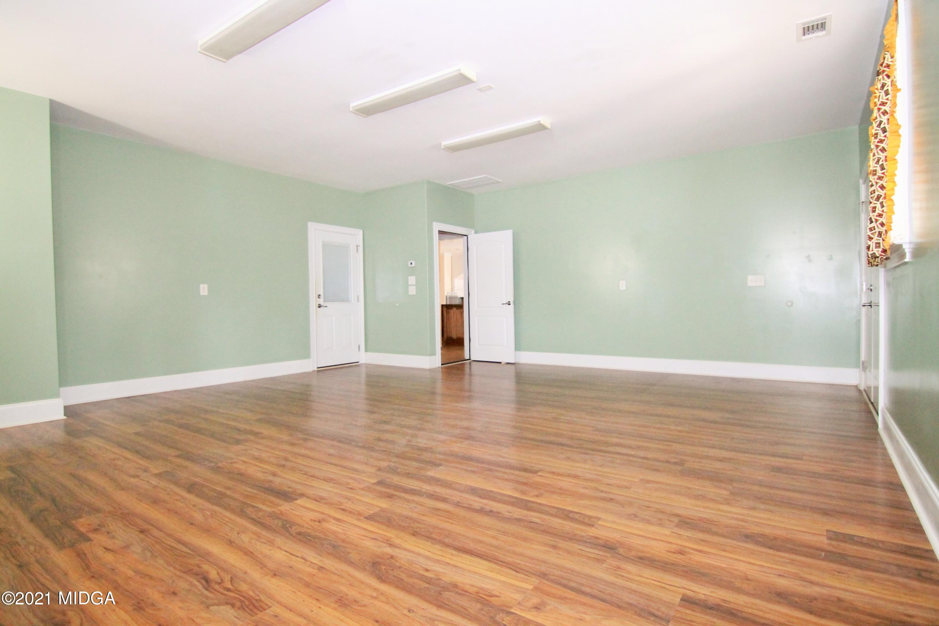 629 Toomer Road Perry, GA 31069 - Photo 31 of 59 a view of empty room with wooden floor