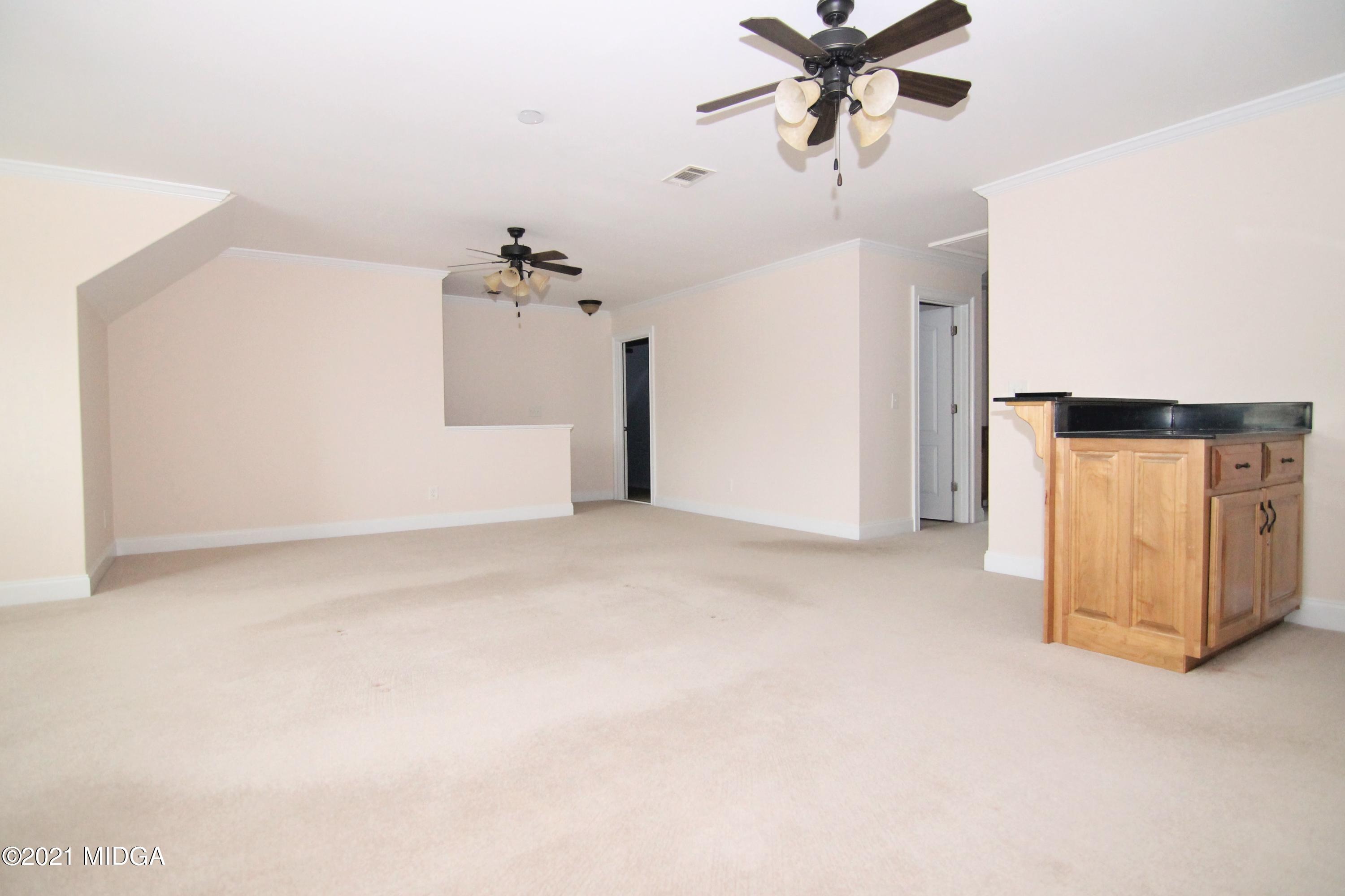 629 Toomer Road Perry, GA 31069 - Photo 33 of 59 a view of a livingroom with a ceiling fan