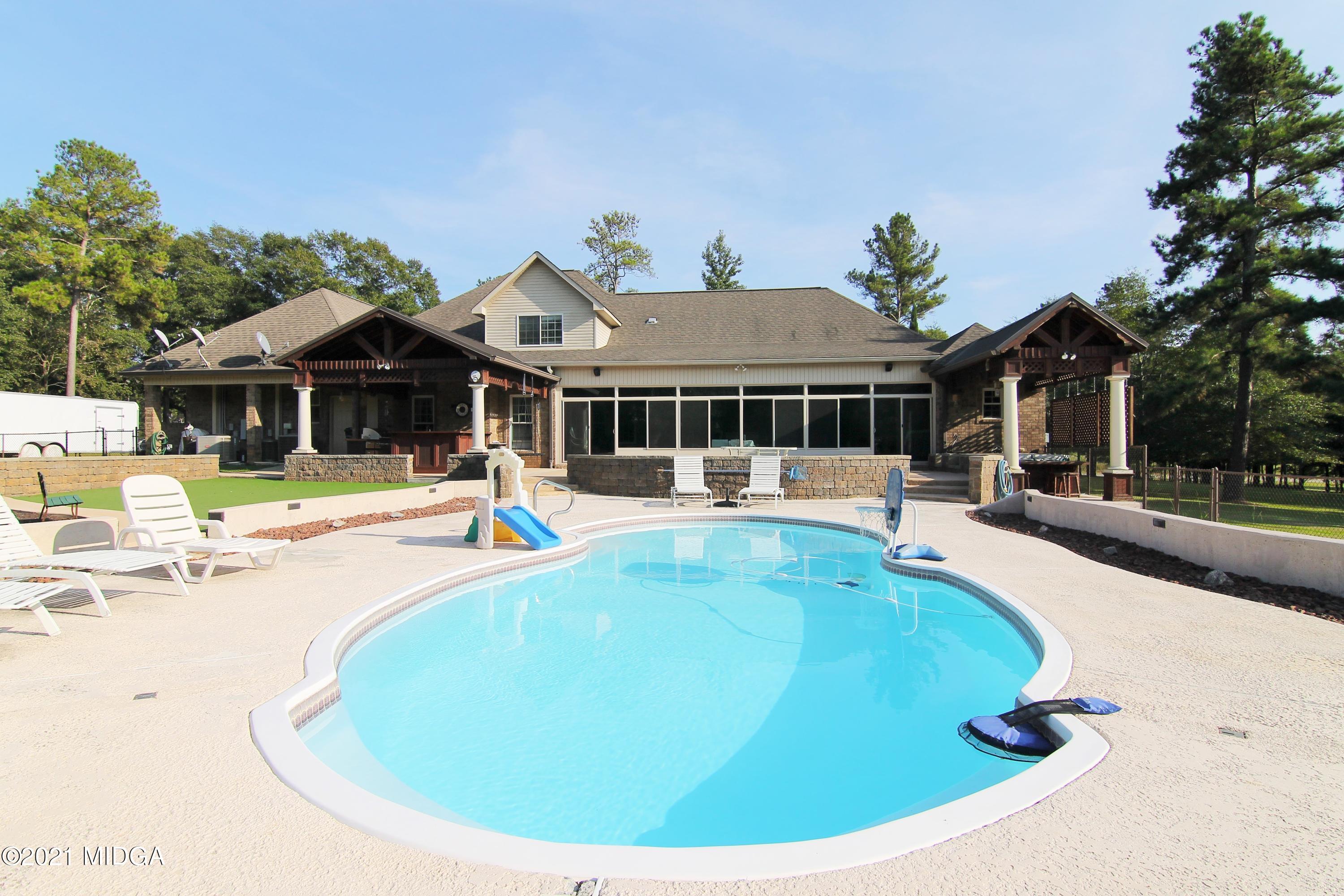 629 Toomer Road Perry, GA 31069 - Photo 57 of 59 a view of a house with swimming pool