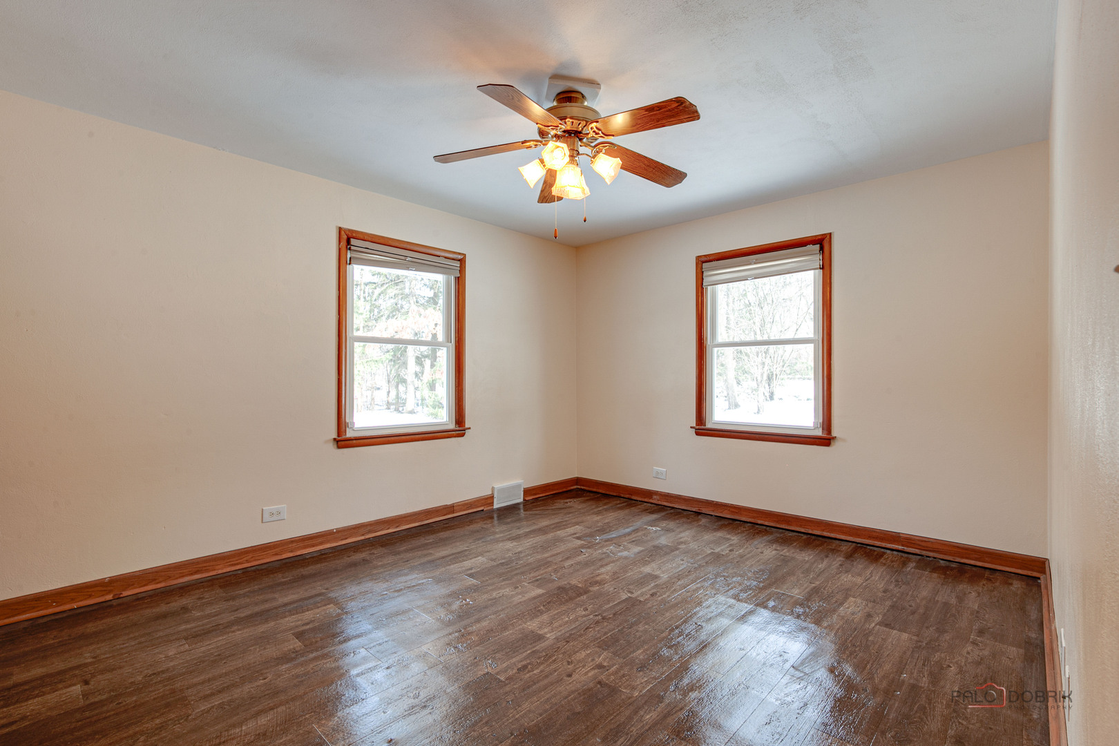 15983 West Wadsworth Road Wadsworth, IL 60083 - Photo 11 of 33 a view of an empty room with window and wooden floor