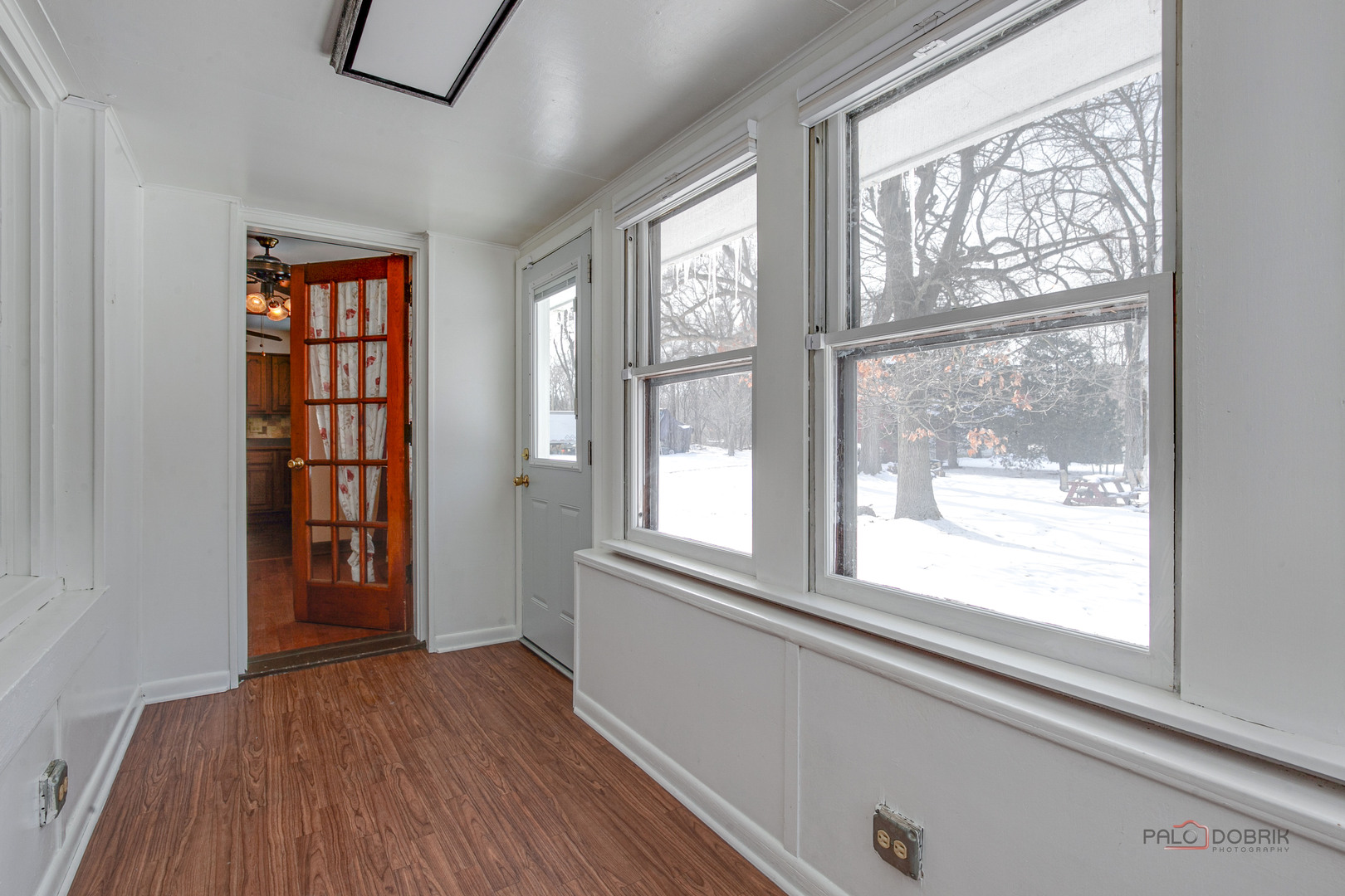 15983 West Wadsworth Road Wadsworth, IL 60083 - Photo 17 of 33 a view of an empty room with wooden floor and a window
