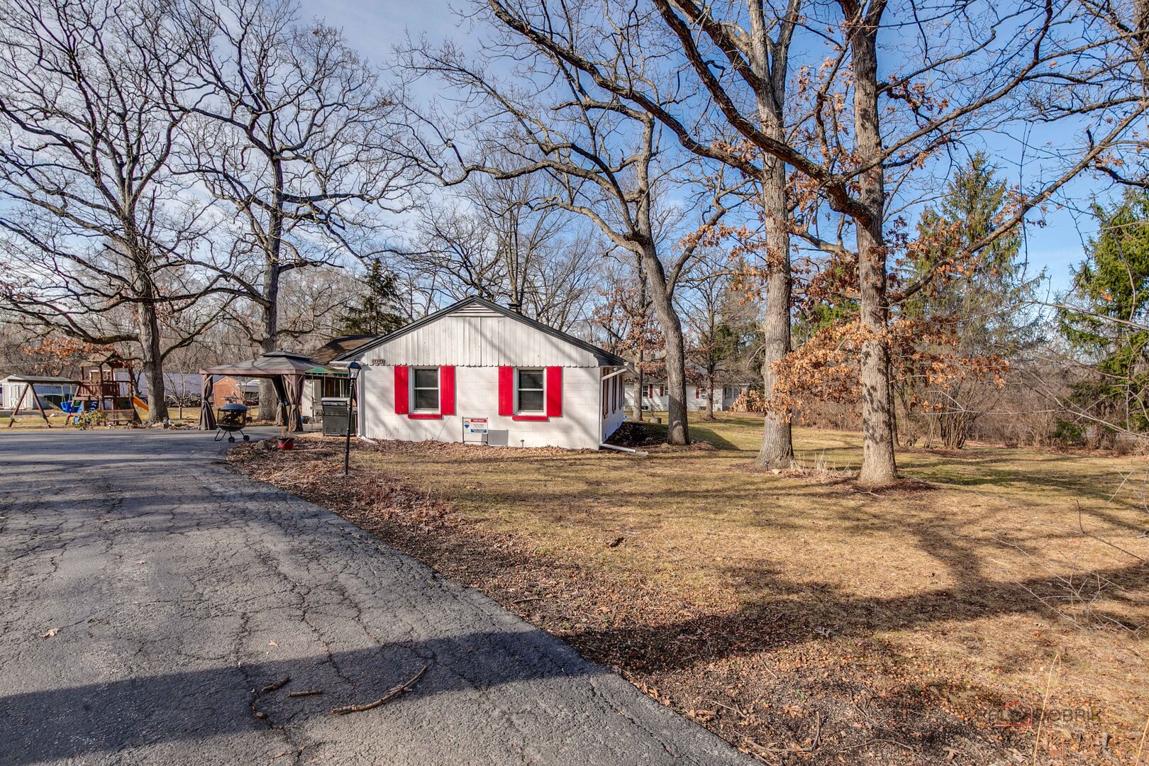 15983 West Wadsworth Road Wadsworth, IL 60083 - Photo 24 of 33 a front view of a house with a yard and tree s