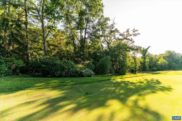 a view of a swimming pool with an outdoor space and seating area