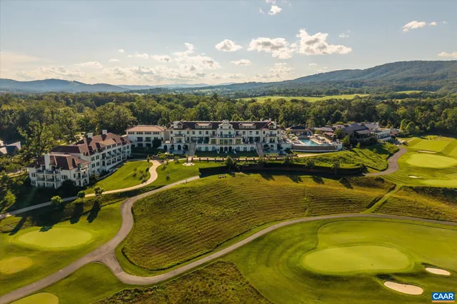a view of a swimming pool with a lake view