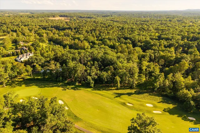 a view of a swimming pool and an outdoor seating