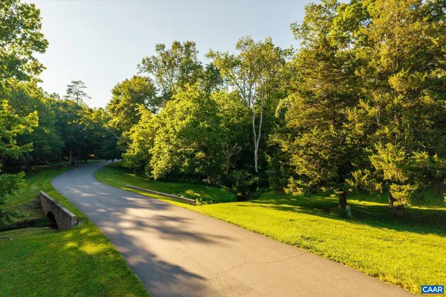 a view of a yard with swimming pool