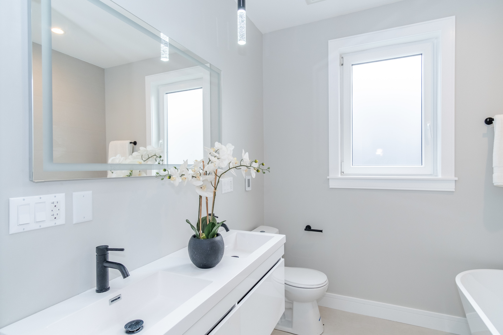 4639 South Indiana Avenue Chicago, IL 60615 - Photo 19 of 24 a bathroom with a sink a toilet and a mirror