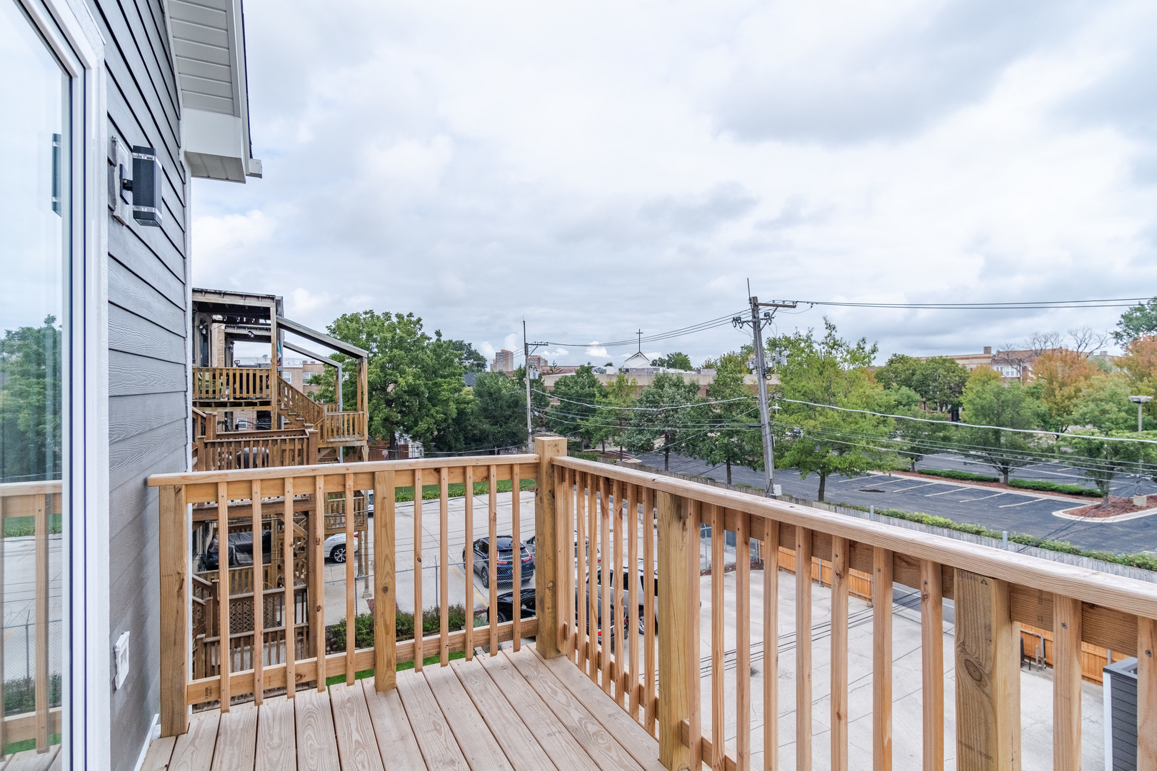 4639 South Indiana Avenue Chicago, IL 60615 - Photo 22 of 24 a view of a wooden balcony with city view