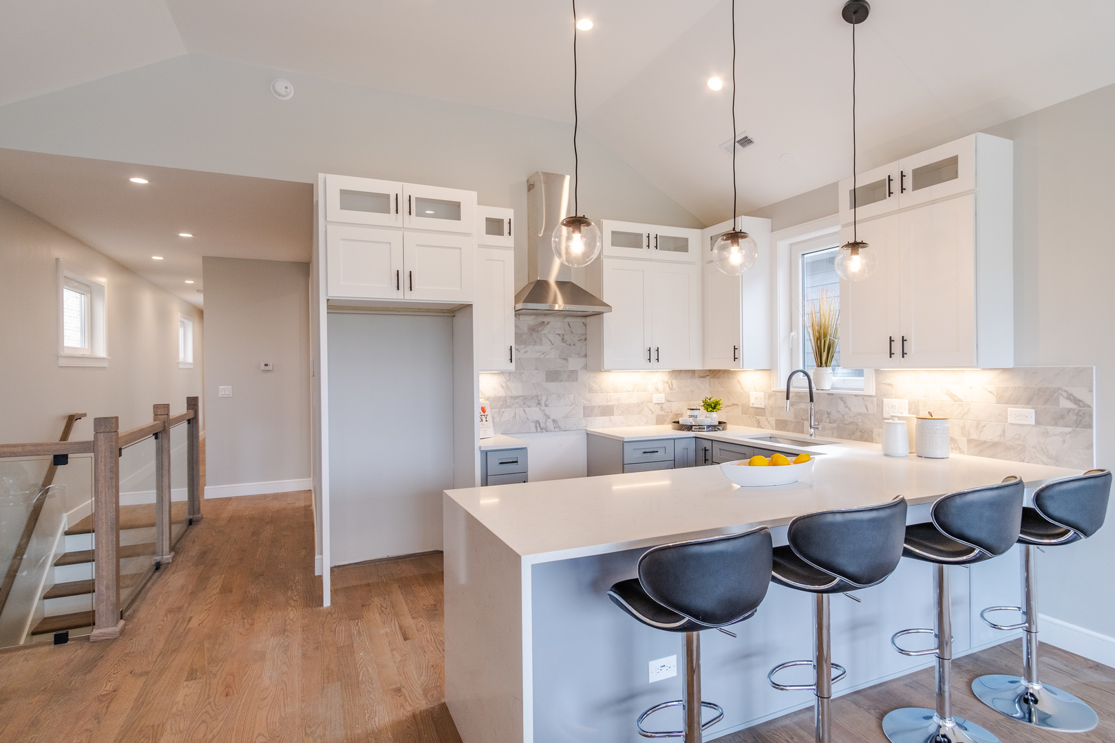 4639 South Indiana Avenue Chicago, IL 60615 - Photo 6 of 24 a kitchen with stainless steel appliances granite countertop a refrigerator a sink a stove a dining table and chairs
