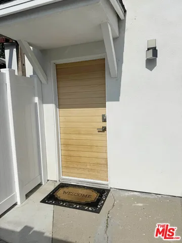 a bathroom with a granite countertop shower and a sink