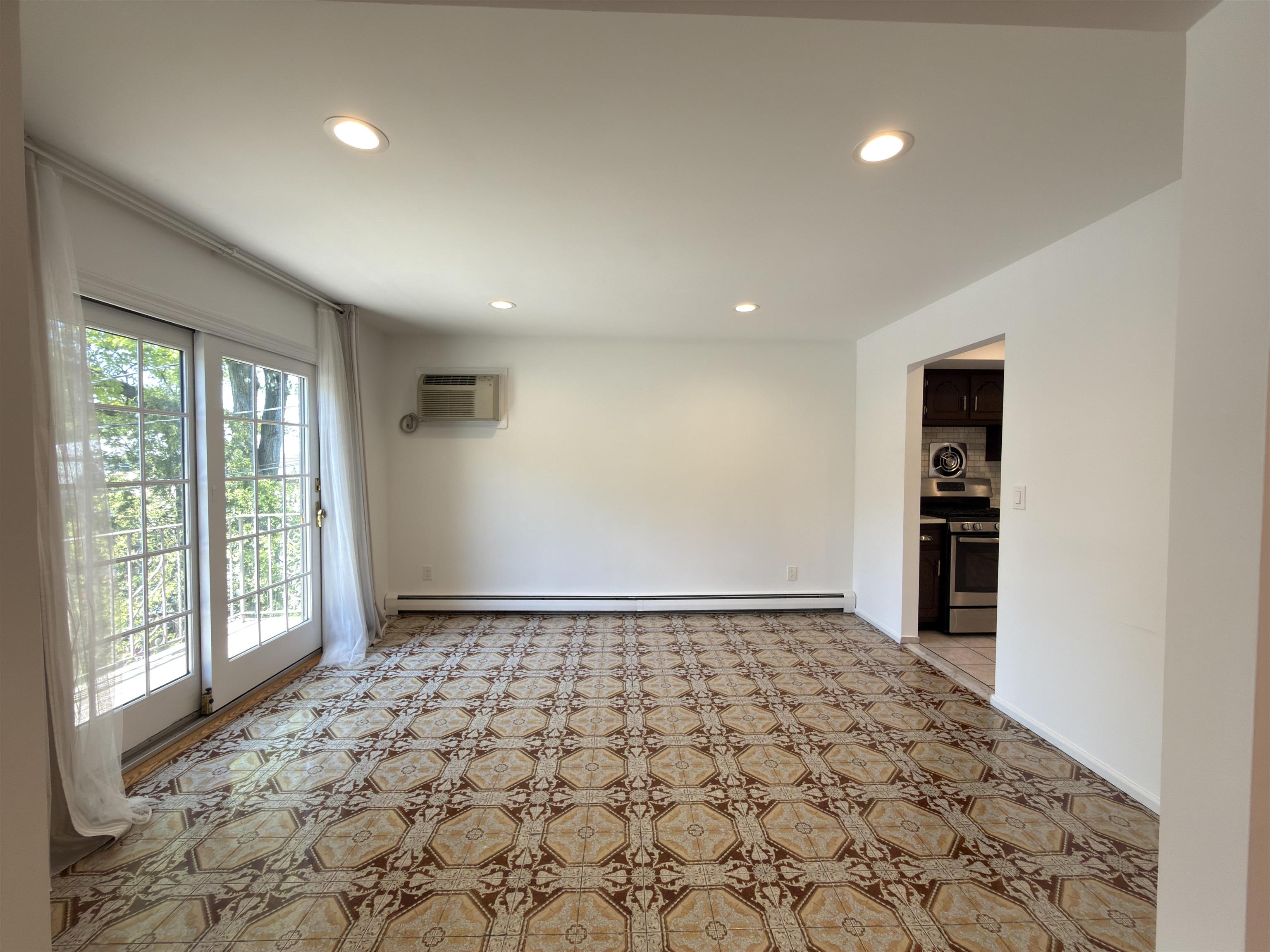 531 Day Avenue, Unit 1 Ridgefield, NJ 07657 - Photo 15 of 32 a view of empty room with wooden floor and fan