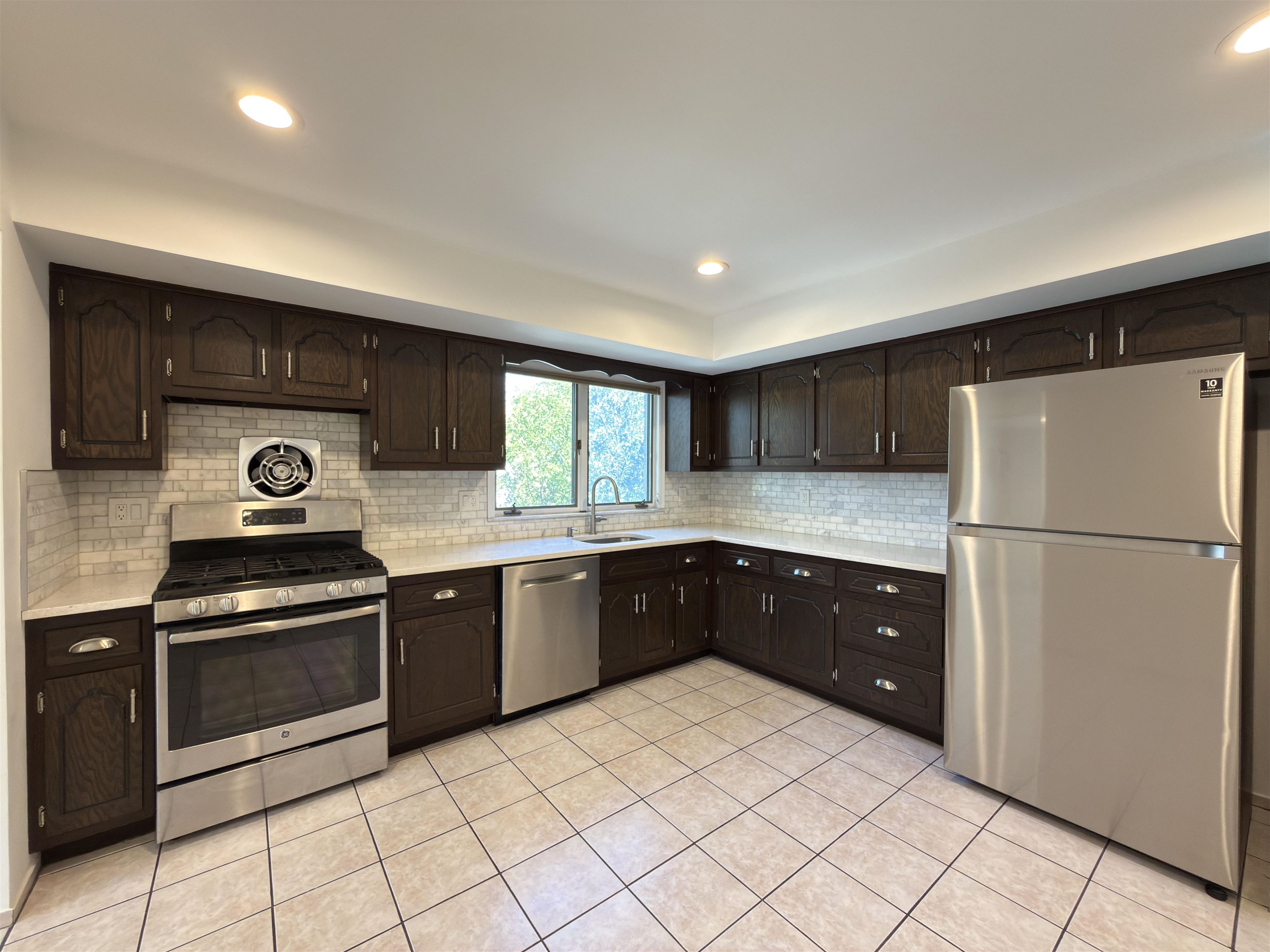 531 Day Avenue, Unit 1 Ridgefield, NJ 07657 - Photo 19 of 32 a kitchen with a refrigerator sink and stove