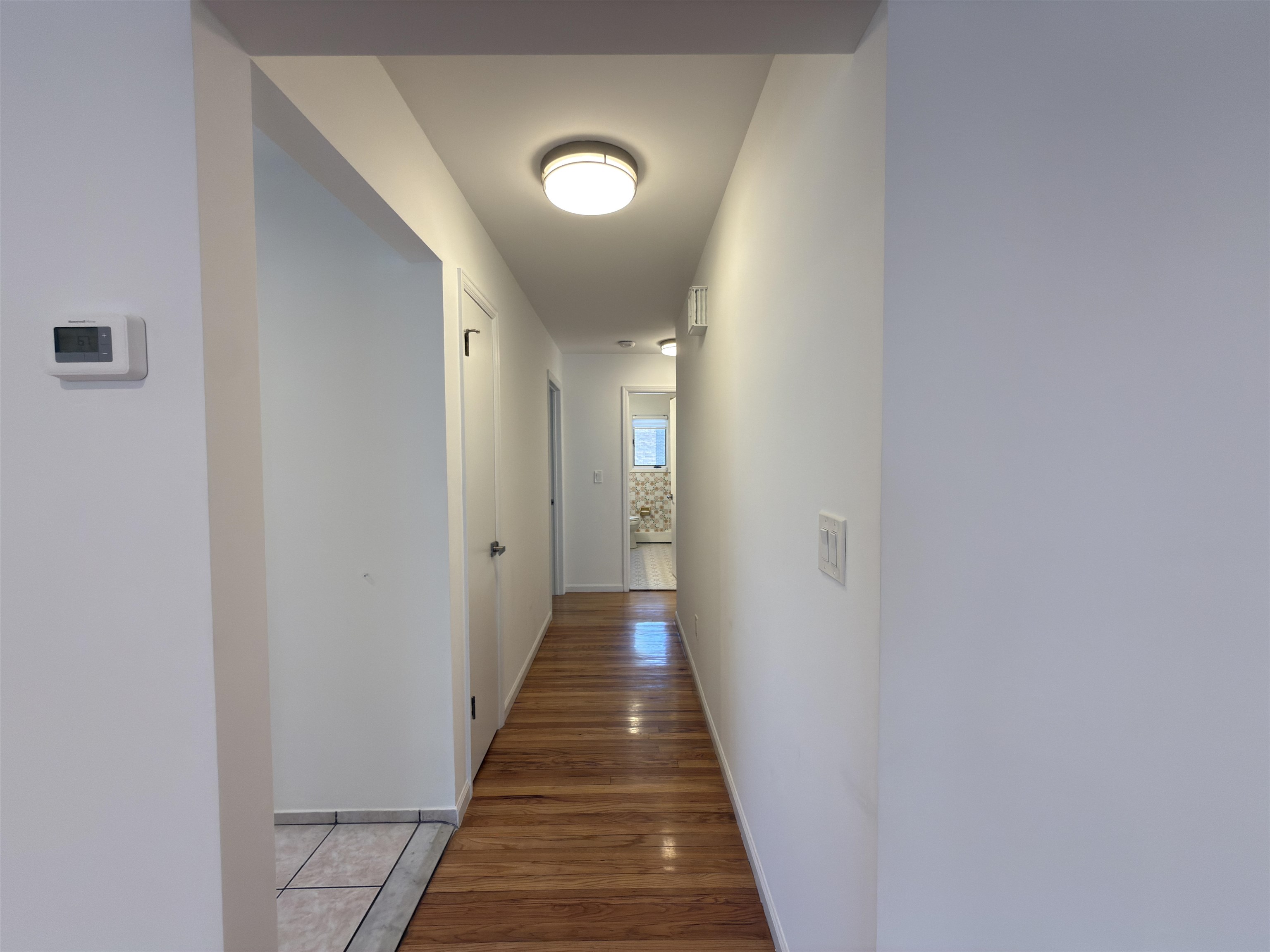 531 Day Avenue, Unit 1 Ridgefield, NJ 07657 - Photo 20 of 32 a view of a hallway with wooden floor