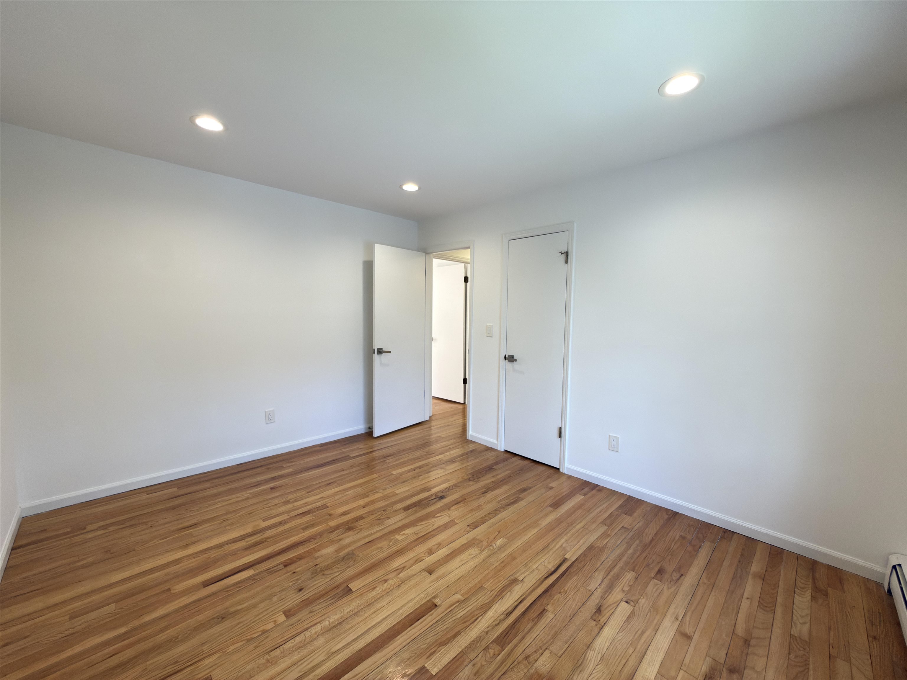 531 Day Avenue, Unit 1 Ridgefield, NJ 07657 - Photo 21 of 32 a view of room with wooden floor and fan