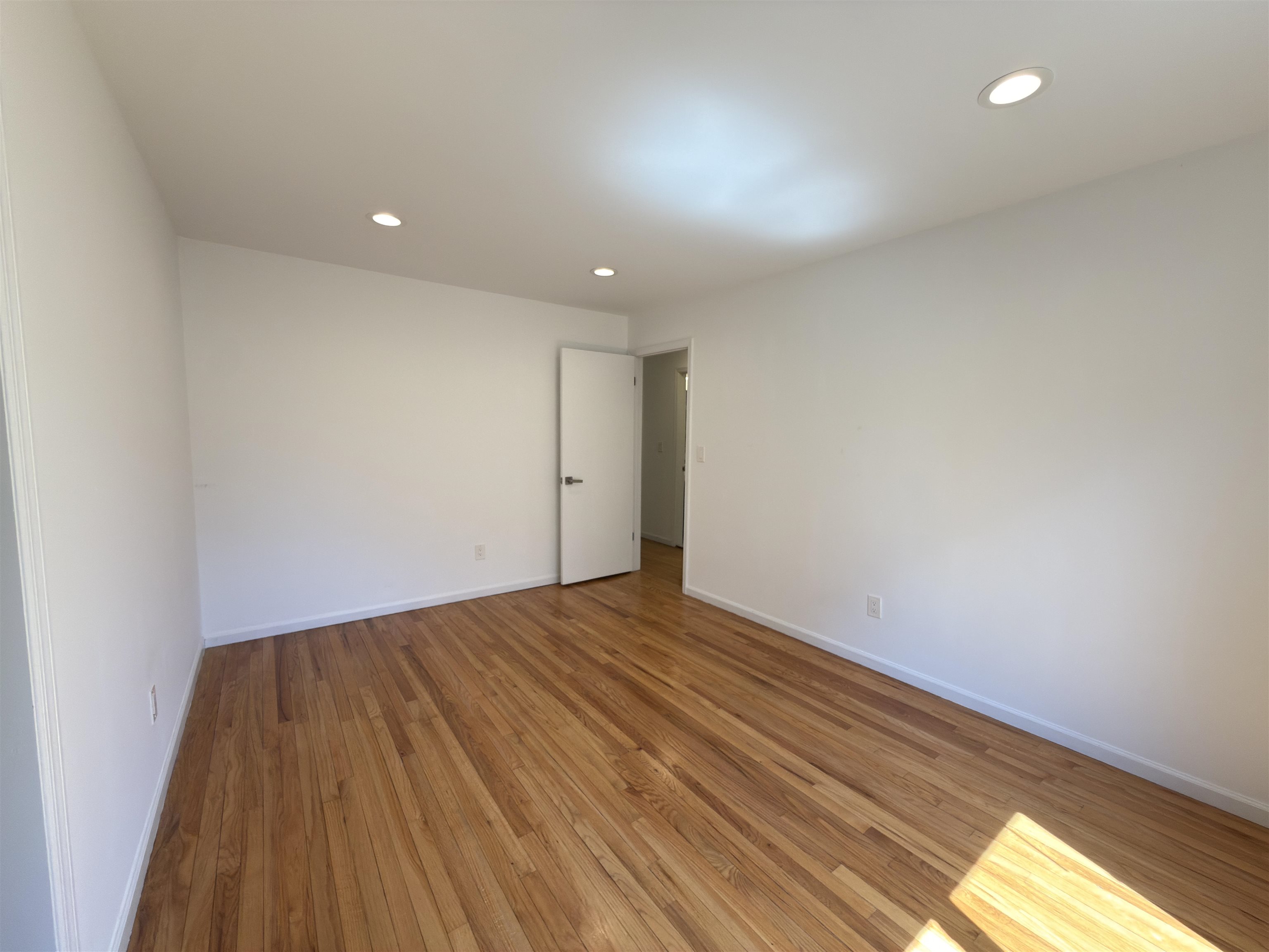 531 Day Avenue, Unit 1 Ridgefield, NJ 07657 - Photo 22 of 32 a view of room with wooden floor and fan