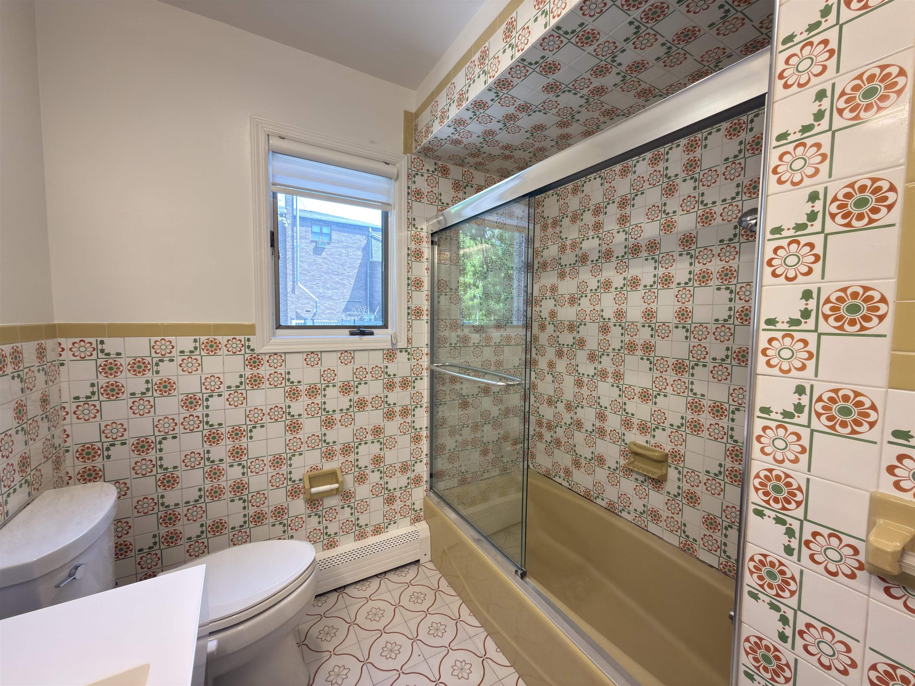 531 Day Avenue, Unit 1 Ridgefield, NJ 07657 - Photo 24 of 32 a bathroom with a toilet and a shower curtain
