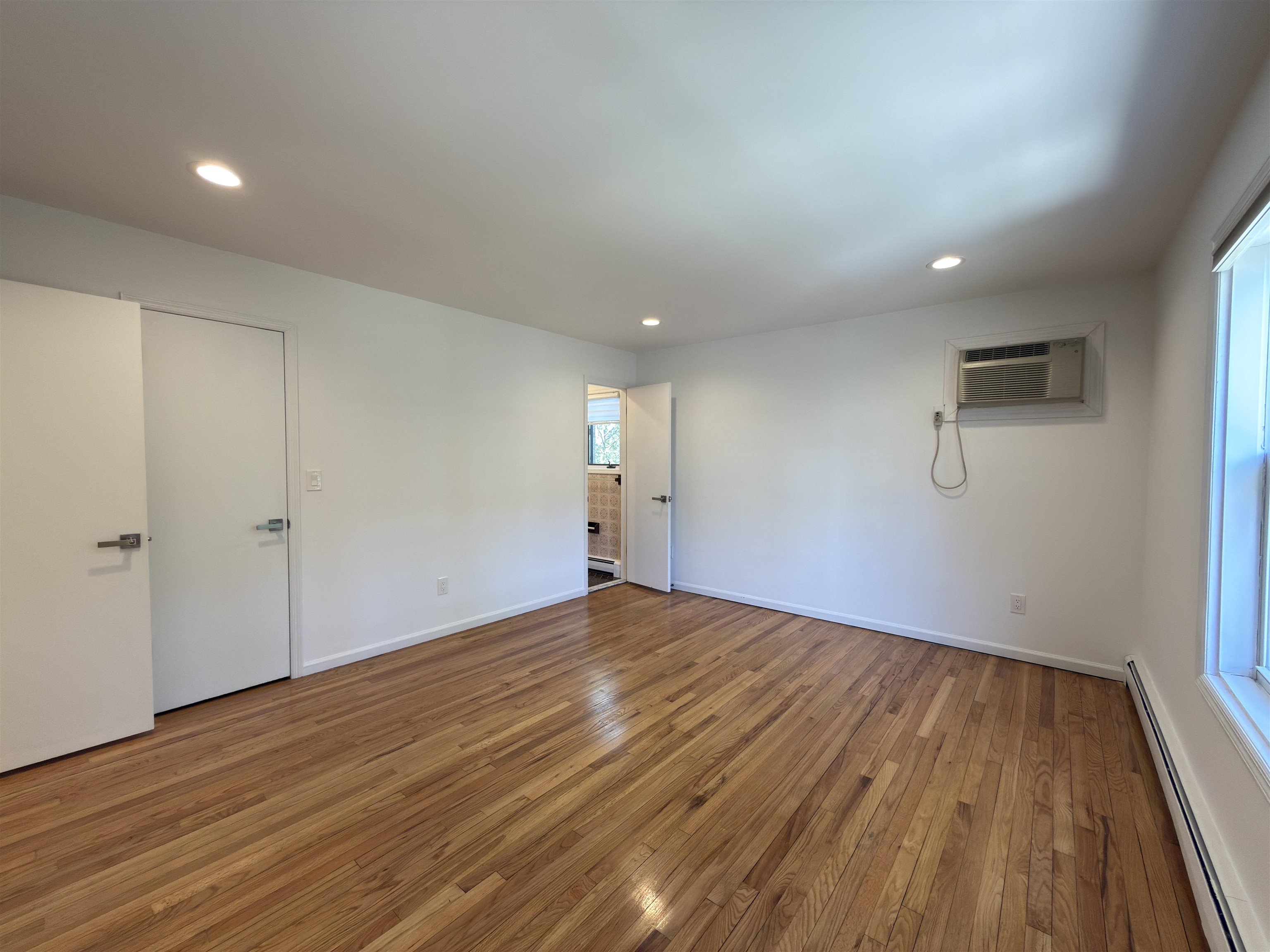 531 Day Avenue, Unit 1 Ridgefield, NJ 07657 - Photo 25 of 32 a view of empty room with wooden floor and fan