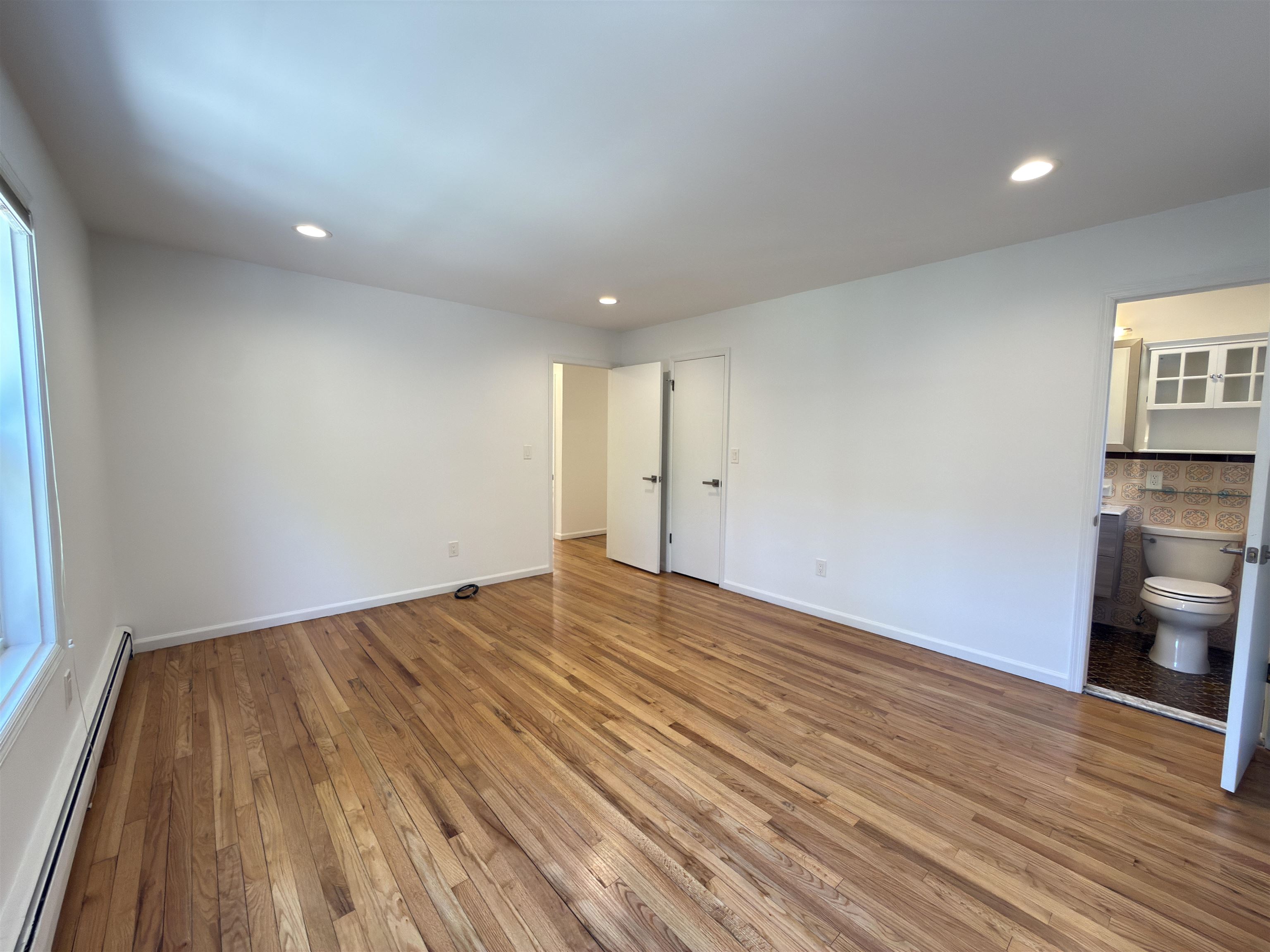 531 Day Avenue, Unit 1 Ridgefield, NJ 07657 - Photo 26 of 32 a view of empty room with wooden floor and fan
