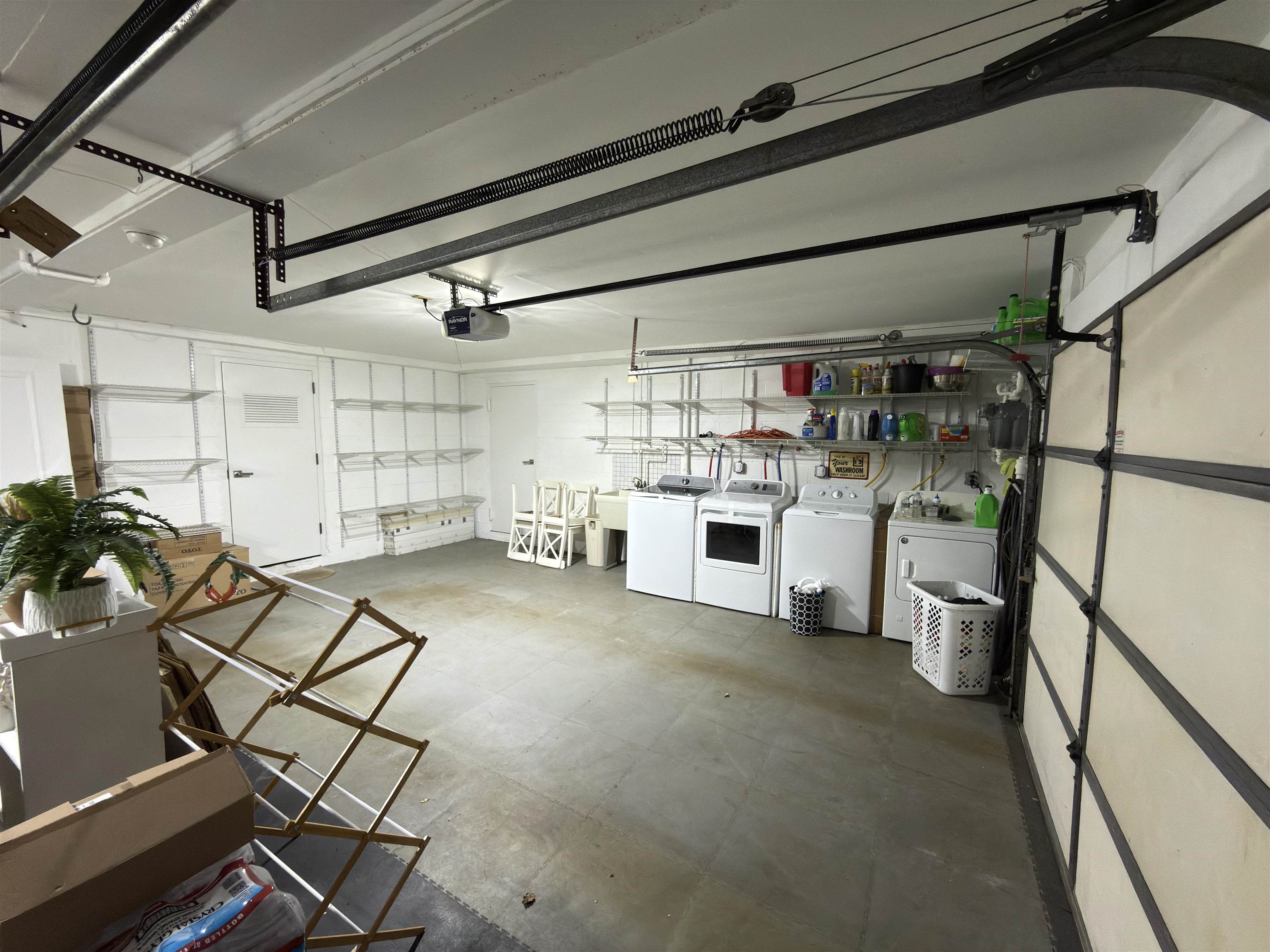 531 Day Avenue, Unit 1 Ridgefield, NJ 07657 - Photo 28 of 32 a kitchen with a refrigerator and white cabinets