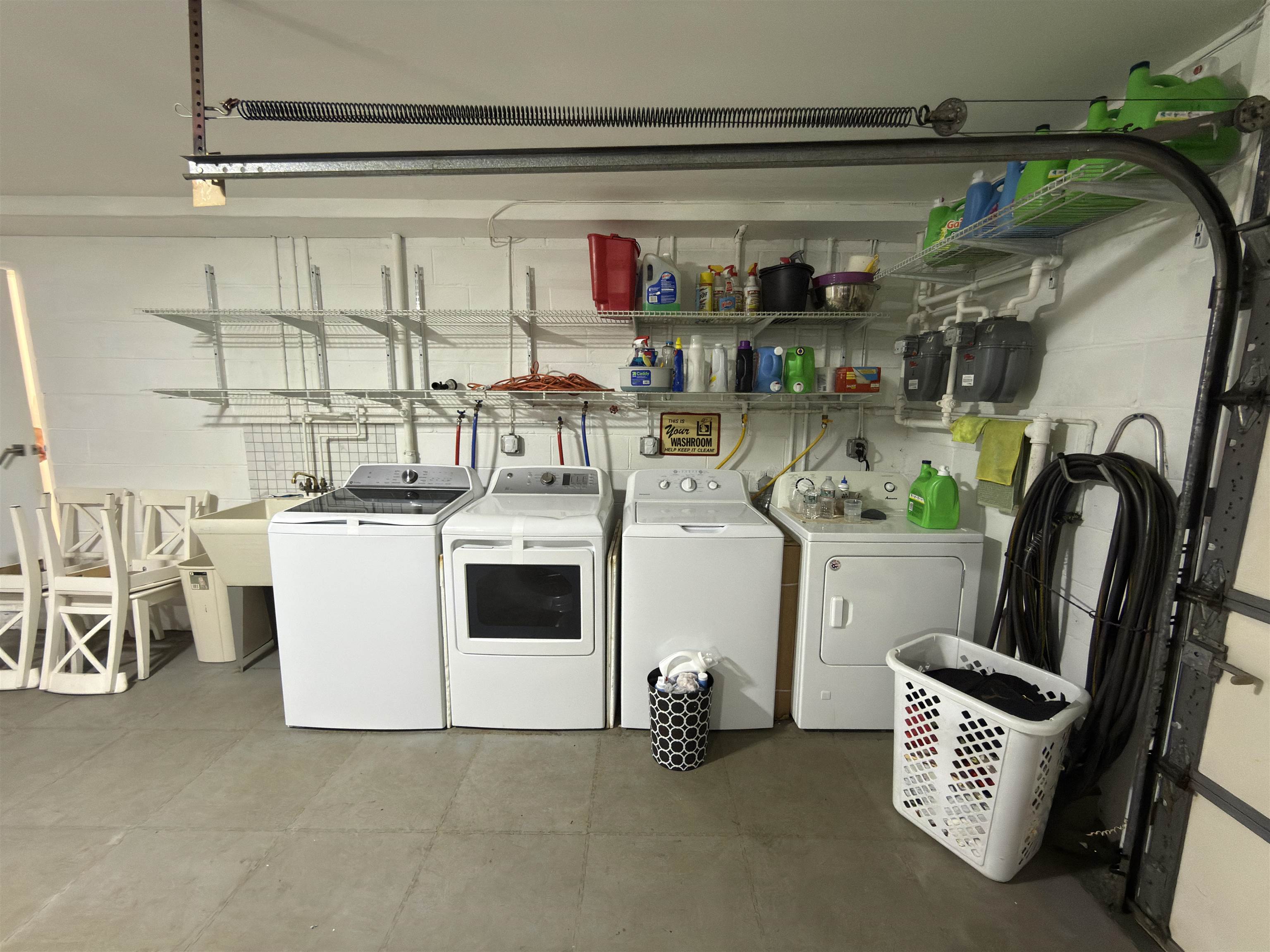 531 Day Avenue, Unit 1 Ridgefield, NJ 07657 - Photo 29 of 32 a utility room with a washer dryer and bicycles