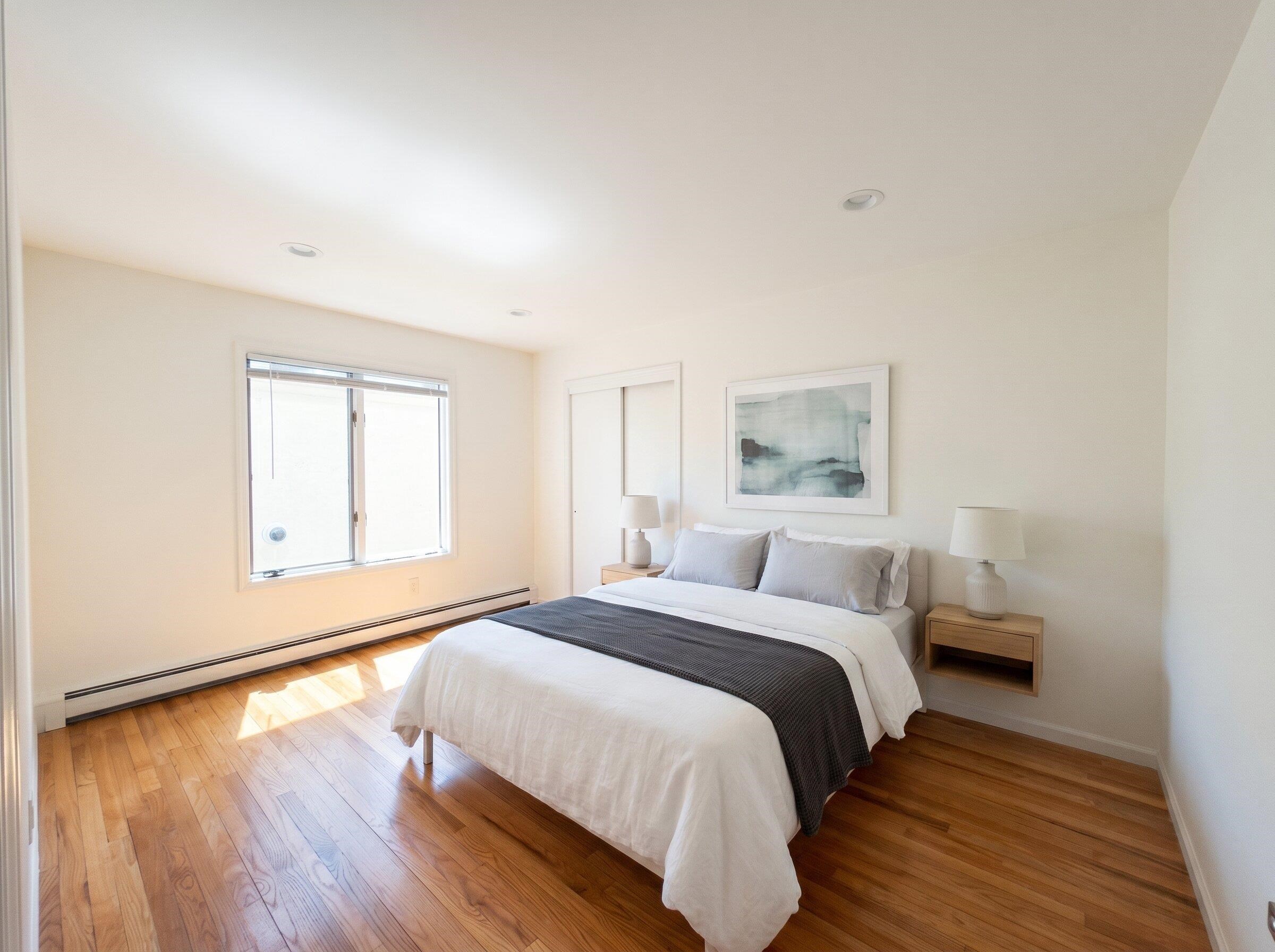 531 Day Avenue, Unit 1 Ridgefield, NJ 07657 - Photo 7 of 32 a bedroom with a bed and a window