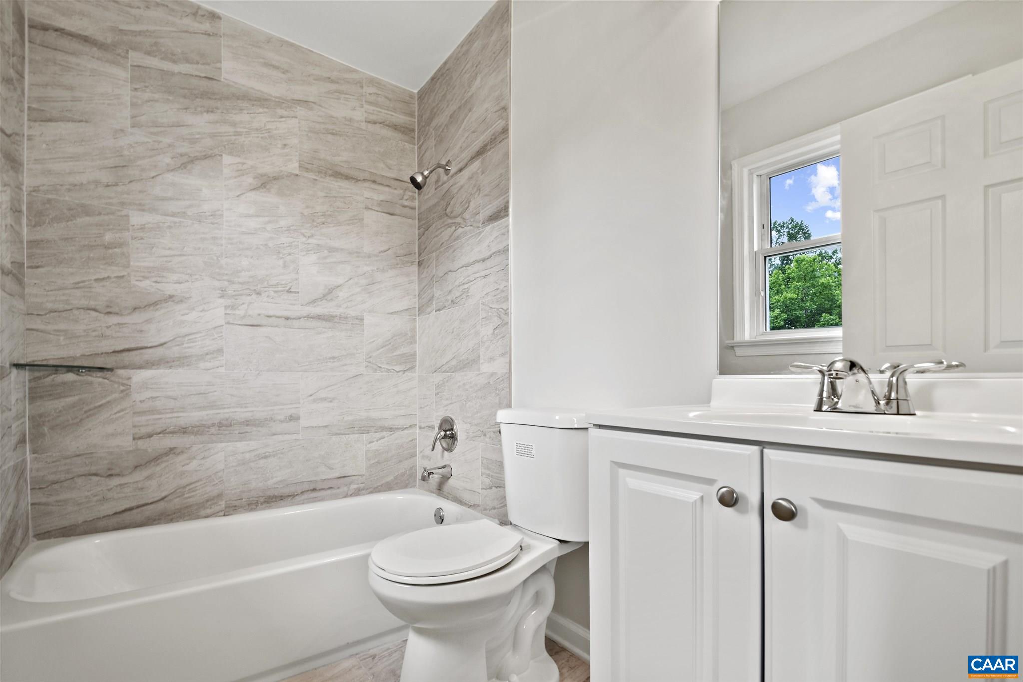 2614 Huntington Road Charlottesville, VA 22901 - Photo 15 of 29 a bathroom with a sink toilet and shower