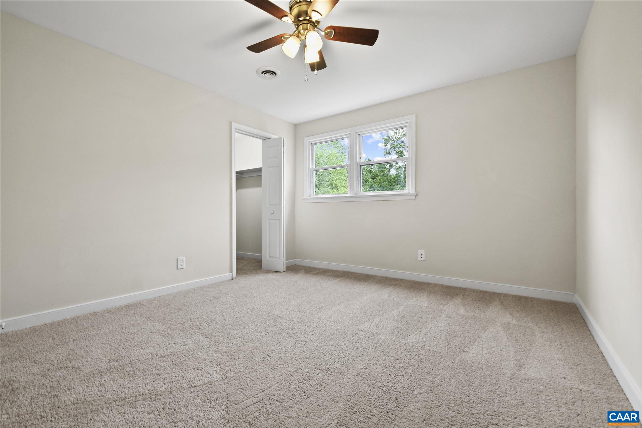 2614 Huntington Road Charlottesville, VA 22901 - Photo 19 of 29 an empty room with windows and fan