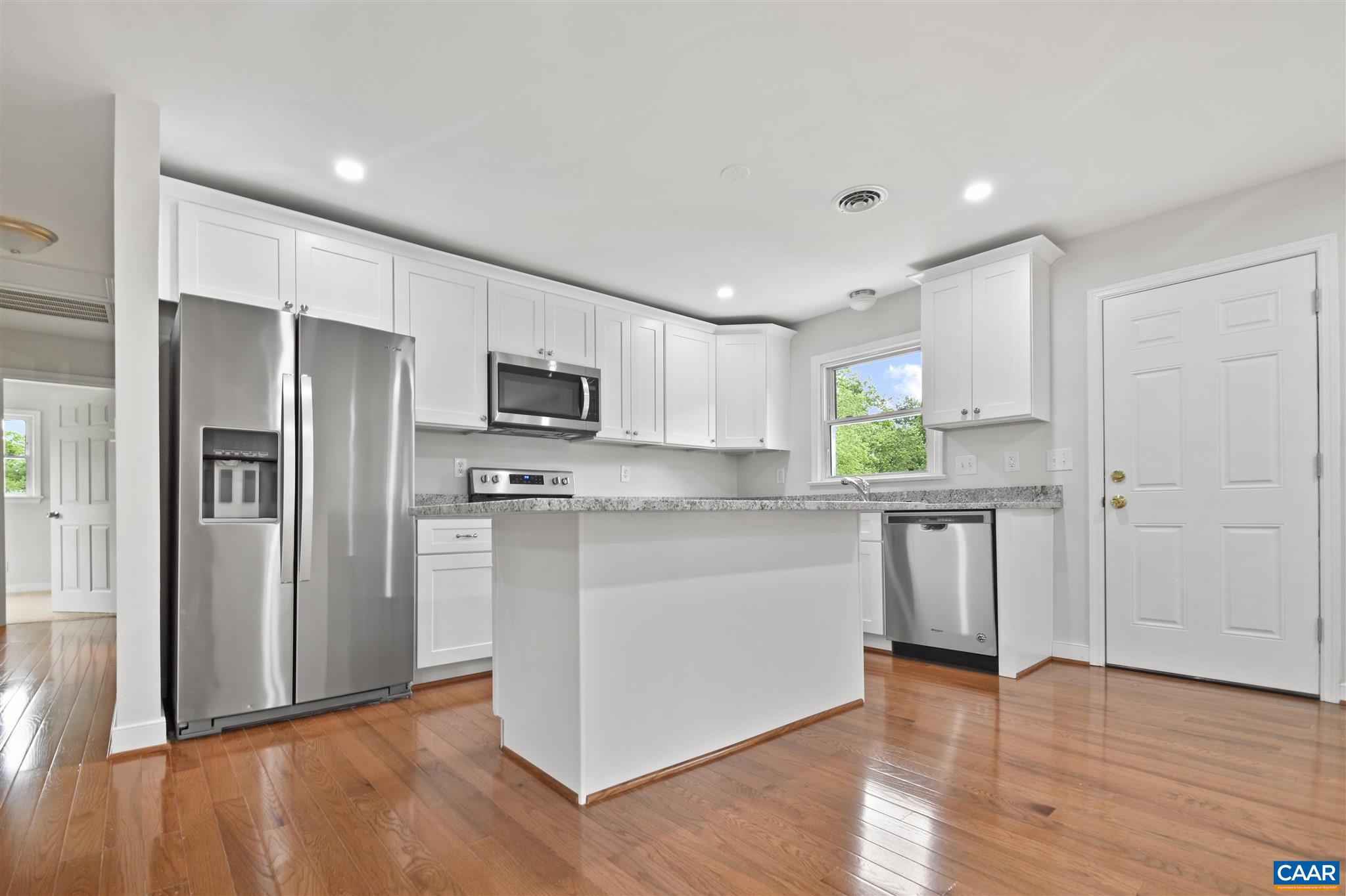 2614 Huntington Road Charlottesville, VA 22901 - Photo 4 of 29 a kitchen with stainless steel appliances granite countertop a refrigerator and a stove top oven