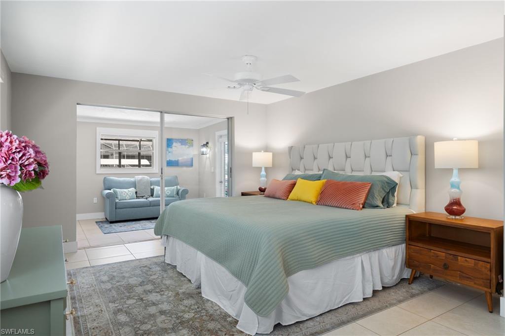 482 Trade Winds Avenue Naples, FL 34108 - Photo 14 of 26 a bedroom with a bed and window