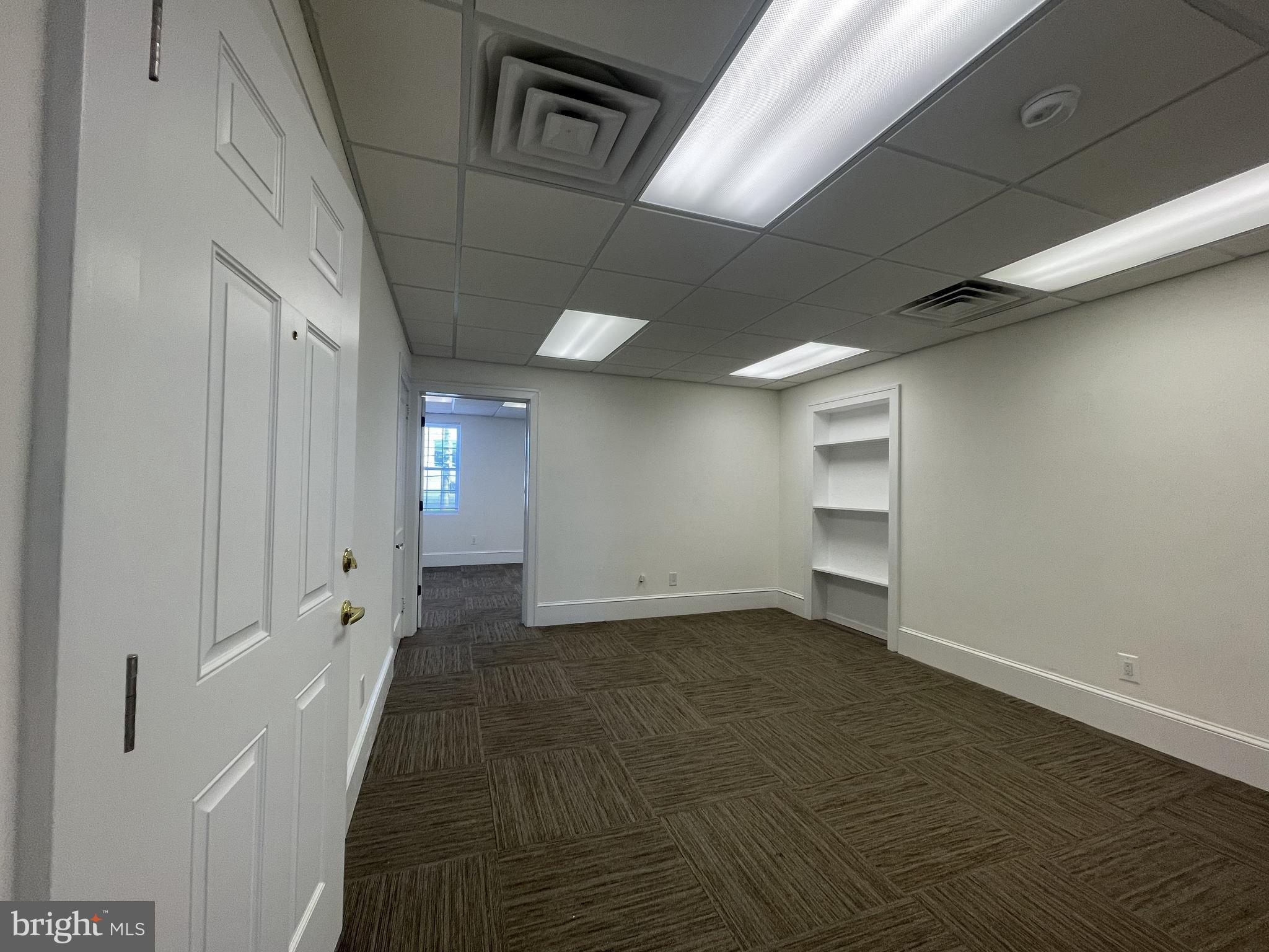 200 High Street West Glassboro, NJ 08028 - Photo 5 of 14 a view of an empty room with wooden floor