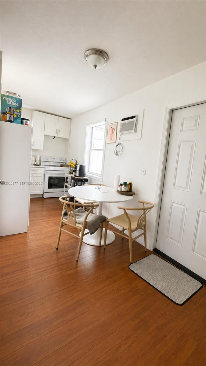 2727 Southwest 24th Street Miami, FL 33145 - Photo 18 of 18 a workspace with furniture and wooden floor