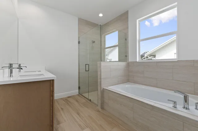 a bathroom with a bathtub and a sink