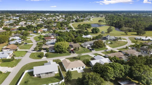 an aerial view of residential houses with outdoor space