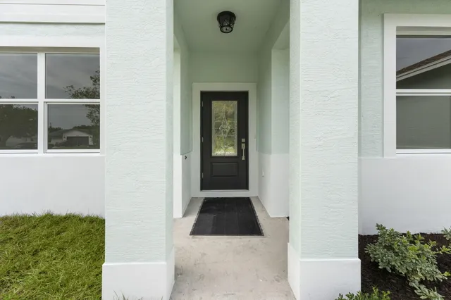 a view of a door and a window