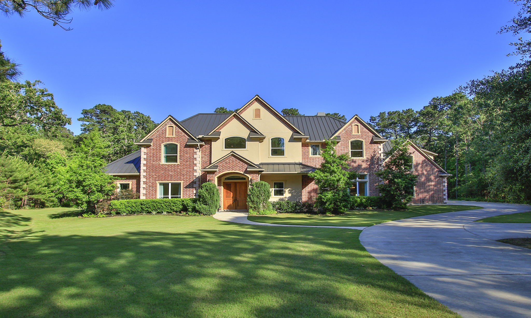 36702 Deer Valley Magnolia, TX 77355 - Photo 5 of 46 a front view of a house with a yard