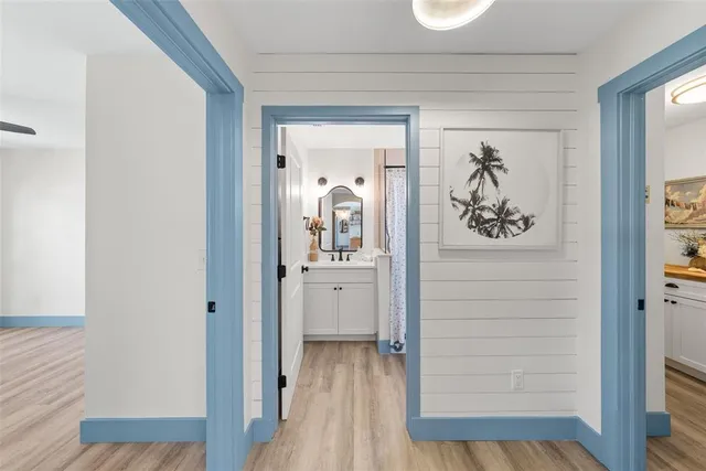 a view of walk in closet with clothes