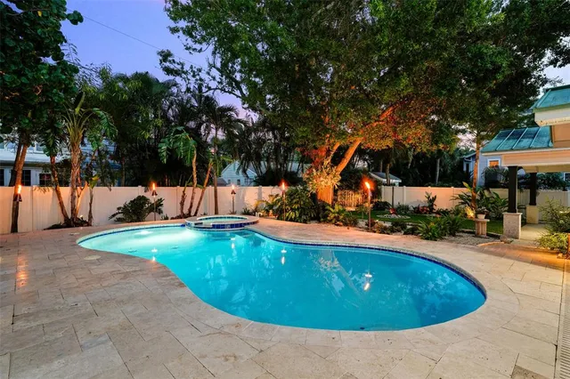 a view of a swimming pool with an outdoor space and seating area