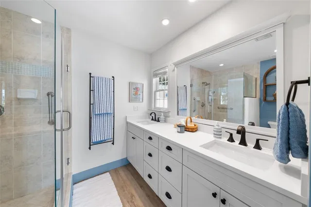 a bathroom with a sink toilet and shower