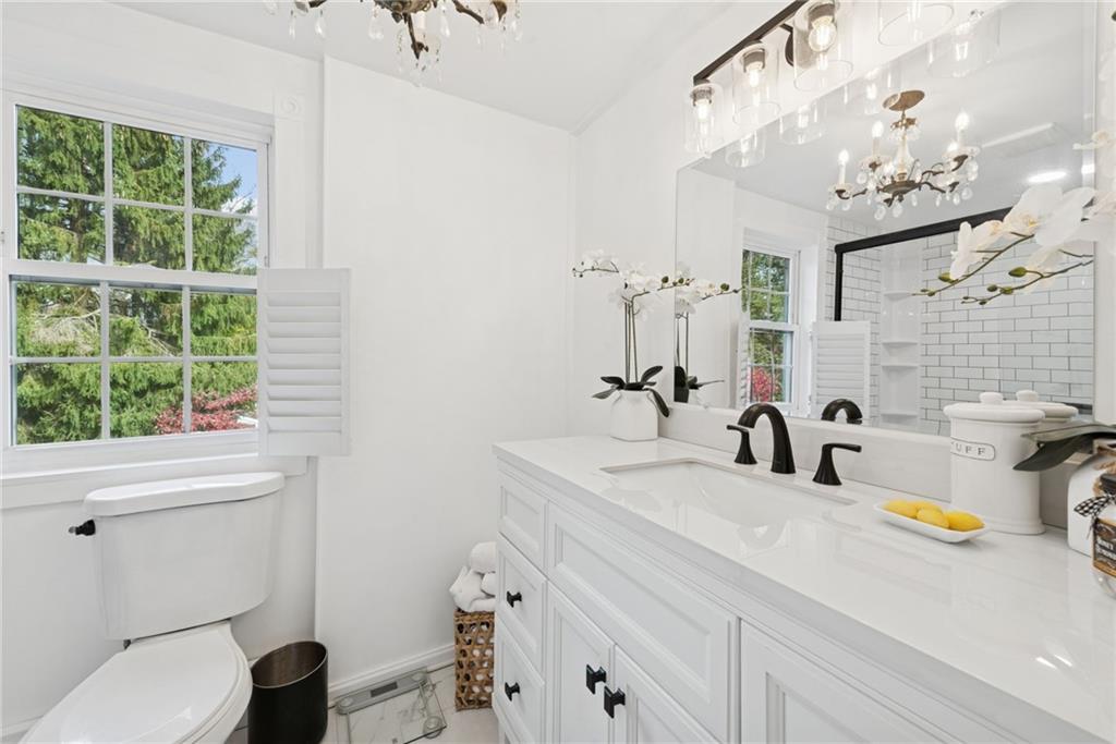 3024 Hyland Road Irwin, PA 15642 - Photo 32 of 45 a bathroom with a sink a toilet and a mirror