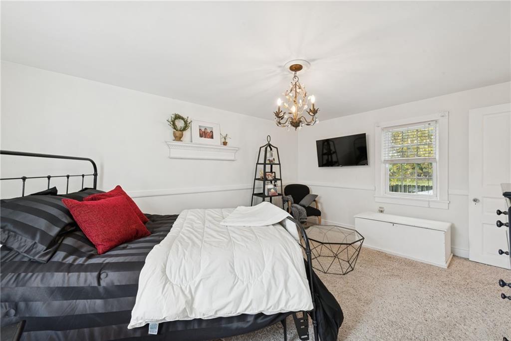 3024 Hyland Road Irwin, PA 15642 - Photo 34 of 45 a bedroom with a bed and a flat screen tv