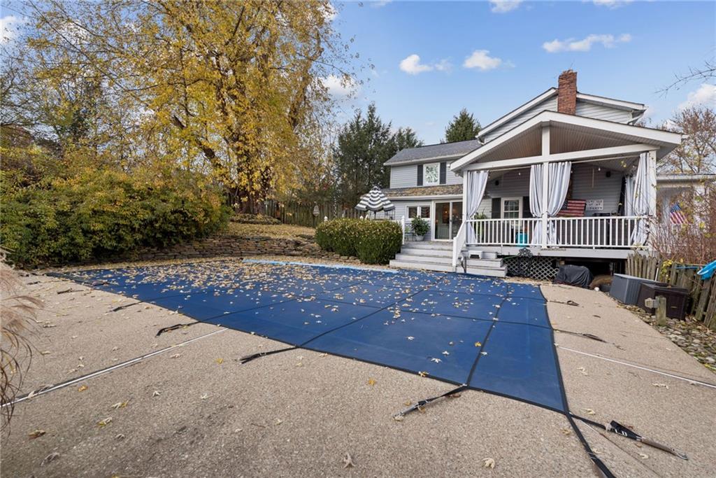 3024 Hyland Road Irwin, PA 15642 - Photo 40 of 45 a view of a white house next to a yard with potted plants