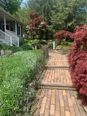 a view of backyard with a patio
