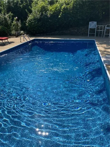 a view of outdoor space with wooden floor