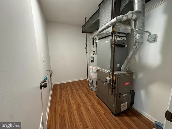 a view of hallway with wooden floor