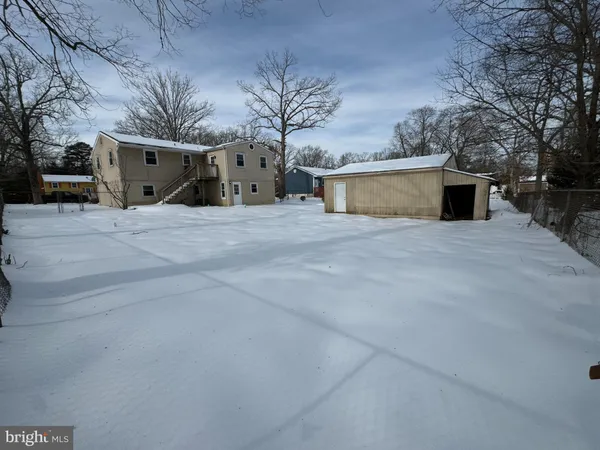 a view of a house with a yard and garage