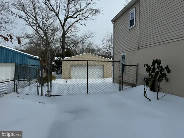 a view of a house with a yard and garage