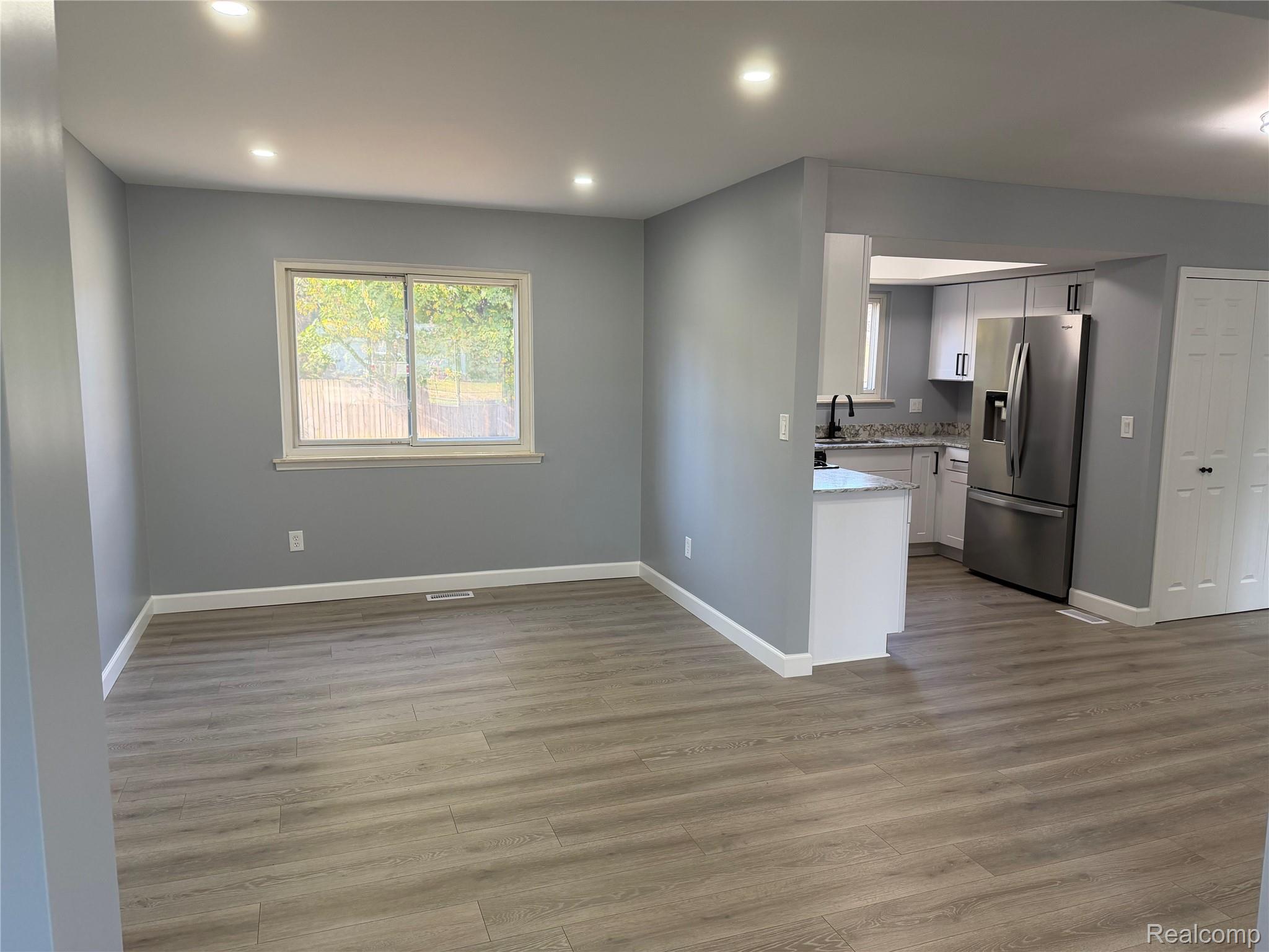 20698 Coachwood Road Riverview, MI 48193 - Photo 6 of 37 Unfurnished living room with light wood-type flooring and recessed lighting