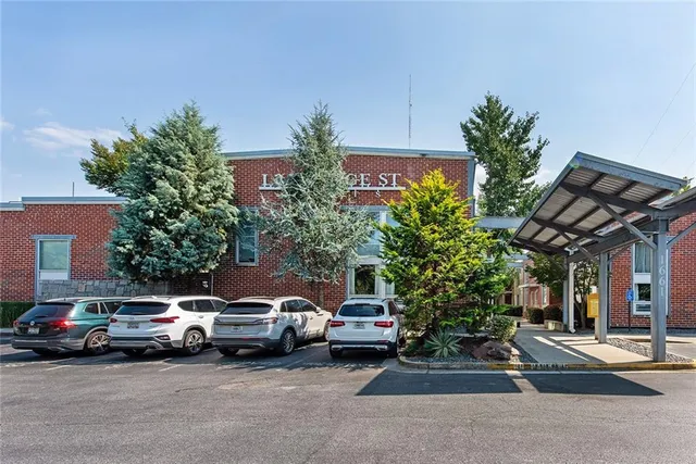 a view of a cars parked in front of a house